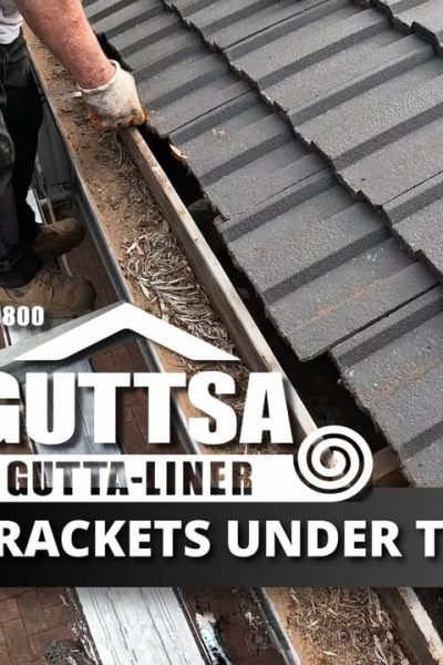 Removing Brackets Under Tiles then screw gutter back to fascia